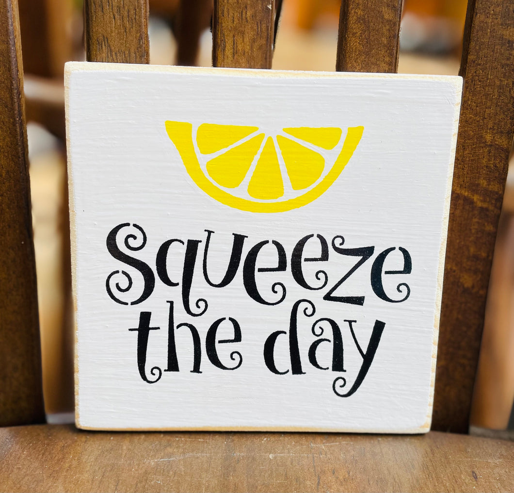 Squeeze the day sign